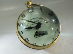 Hanging ball clock with brass surround and glass magnified face