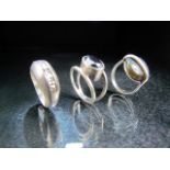 Three Silver rings each set with stones and of contemporary designs