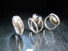 Three Silver rings each set with stones and of contemporary designs