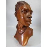 African carved figure of a nude lady facing left