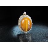 Silver sterling pendant set with Tiger's Eye cabochon stone