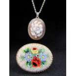 Cameo of a Flower approx 29.5mm x 18.8mm and hung from an 835 silver trace link chain . Together