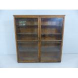 Pitch pine bookcase with glazed doors A/F