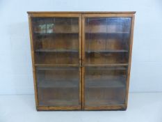 Pitch pine bookcase with glazed doors A/F