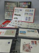 Three albums containing various stamps and an album of first day covers