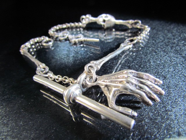Silver Albert style watch chain set with skulls and crossbones