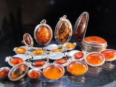 Collection of Amber on Silver Jewellery consisting of Brooches, bracelets, earrings and an Amber