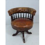 Antique turned mahogany and leather captains chair with galleried frame leading to button back