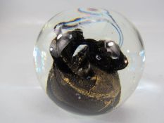 Unusual glass paperweight with eyelet pontil.