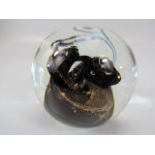 Unusual glass paperweight with eyelet pontil.