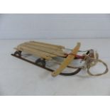 Vintage wooden sledge with feet rests