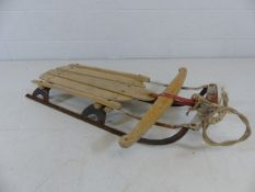 Vintage wooden sledge with feet rests