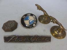 Two Jaguar hood ornaments, MG Car badge, BMW car badge and a Power Glide car badge
