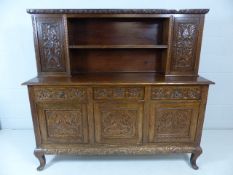 Greenman oak carved dresser with three long drawers over three cupboards