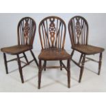 Set of three antique wheelback chairs