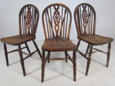 Set of three antique wheelback chairs