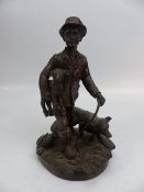 J Bramley bronzed figure of a farmer carrying a lamb with dog at foot.