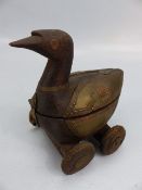 Wooden carved antique figure of a duck mounted with metal on wheels