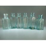 6 antique glass medicine bottles 'Lemonade', 'Fruit juices' etc