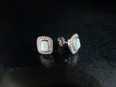 Silver pair of opal panelled earrings