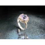 Scottish hallmarked Silver ring set with a single large purple stone (possibly Amethyst).