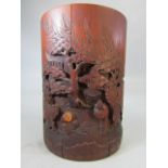 Antique chinese brush pot with carved decoration to front.