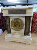Architectural marble mantle clock with brass repousse plaque and columns
