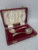 Hallmarked silver tea strainer and tea spoon. marked Sheffield Francis Howard Ltd.