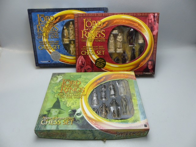 Three chess sets, boxed Lord of the Rings.