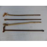 Selection of walking canes and a knobkerrie