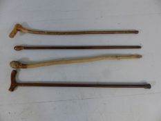 Selection of walking canes and a knobkerrie