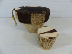 African hide covered drums, one small and one large