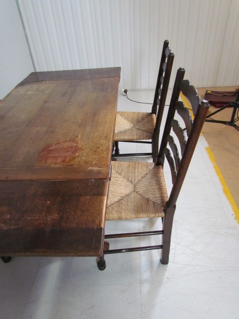 Antique oak dining table with matching rush seated chairs - Image 3 of 5