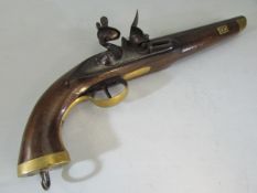 An 18th century poss walnut barrel Flintlock naval pistol with brass mounts.