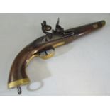 An 18th century poss walnut barrel Flintlock naval pistol with brass mounts.