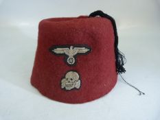 WWII German SS volunteers Red dress cap with central black tassel with woven eagle and totenkopf