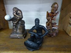 Austin Prod inc figure of a Monkey holding a skull along with an Australian pottery figure from