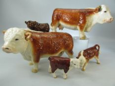 Collection of porcelain cows to include Beswick