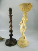 Oak barley twist table lamp with a Bakelite cherub holding an urn