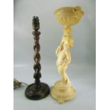 Oak barley twist table lamp with a Bakelite cherub holding an urn