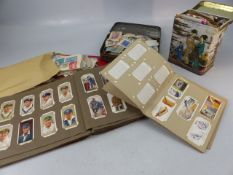 Selection of cigarette cards along with some loose stamps