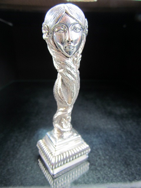 Silver plated art nouveau style figure of a lady in the form of a seal