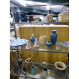 Selection of studio pottery over three shelves