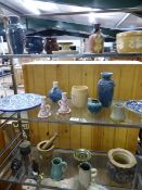 Selection of studio pottery over three shelves