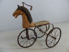 Victorian tricycle in the form of a carved wooden horse with original leather seat (A/F)