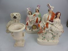 Two Large Staffordshire flatbacks, a staffordshire dog and a urn by Shorter & Son Ltd