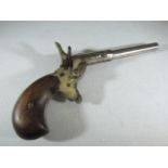 A vintage small calibre blank fire pistol "Made in Belgium" to underside and marked "Futum" the