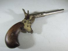 A vintage small calibre blank fire pistol "Made in Belgium" to underside and marked "Futum" the