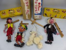 Four Pelham puppets with boxes to include a White Poodle, Cowgirl, Schoolmaster, Pinocchio