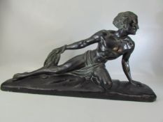 Art deco style plaster figurine of man reclining on a rock holding a rope, marked C Meurice and to